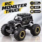Black RC monster truck with oversized off-road tires and yellow-rimmed wheels, shown on a light gray studio background with promotional text and feature icons.